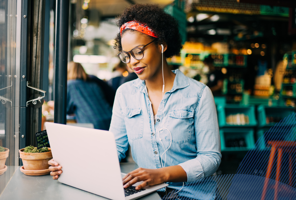 young woman on her laptop in a coffee shop