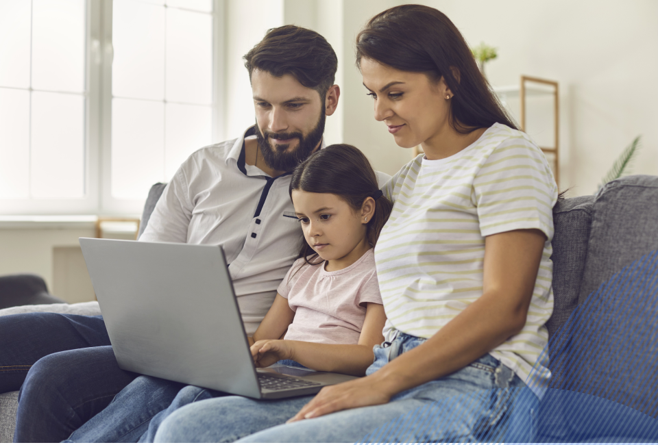 family looking at the laptop